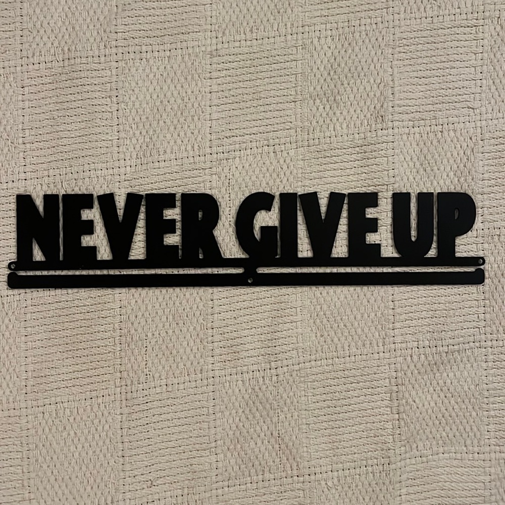 “never give up” medal hanger